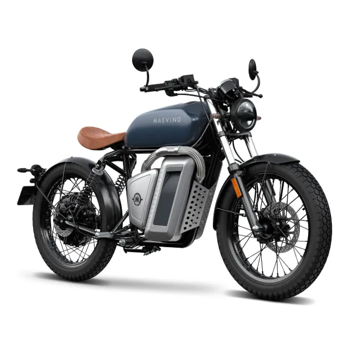 The finished Maeving electric motorcycle in navy, seen from the front three quarter, with a brown quilted seat, spoked wheels and the removable silver battery pack in the frame.