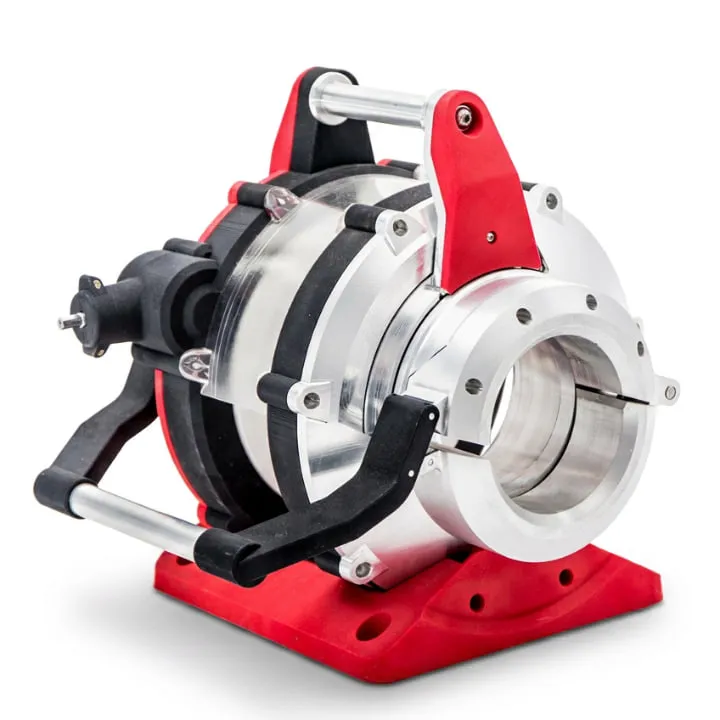 The ProCut pipe cutting tool on its red base, a machined aluminium rotating head with a clear guard, black clamping straps and a tubular handle, with the open jaw that the pipe passes through facing the camera.